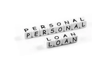 closeup finance concept in blocks with words Personal loan